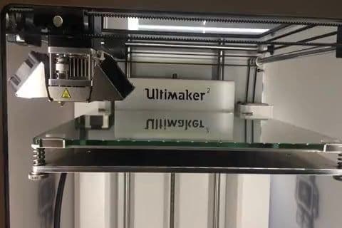 An Ultimaker 3D printer part way through building a model